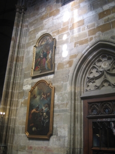 Two paintings next to a doorway