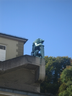 A gargoyle on the corner of a building